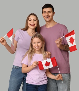 Family holding Canadian flags applying for Canada visa from Dubai
