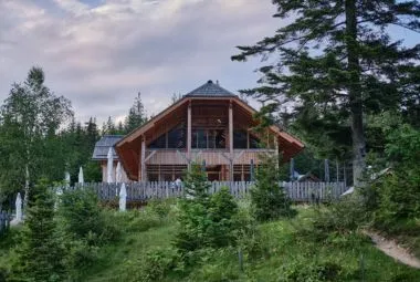 White Wooden House Near Flower Field