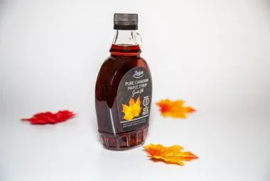 Maple Leaves around Maple Syrup Bottle